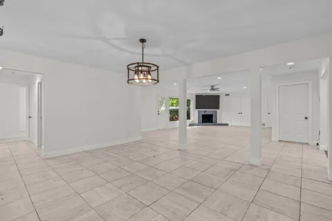 a view of empty room with a fireplace