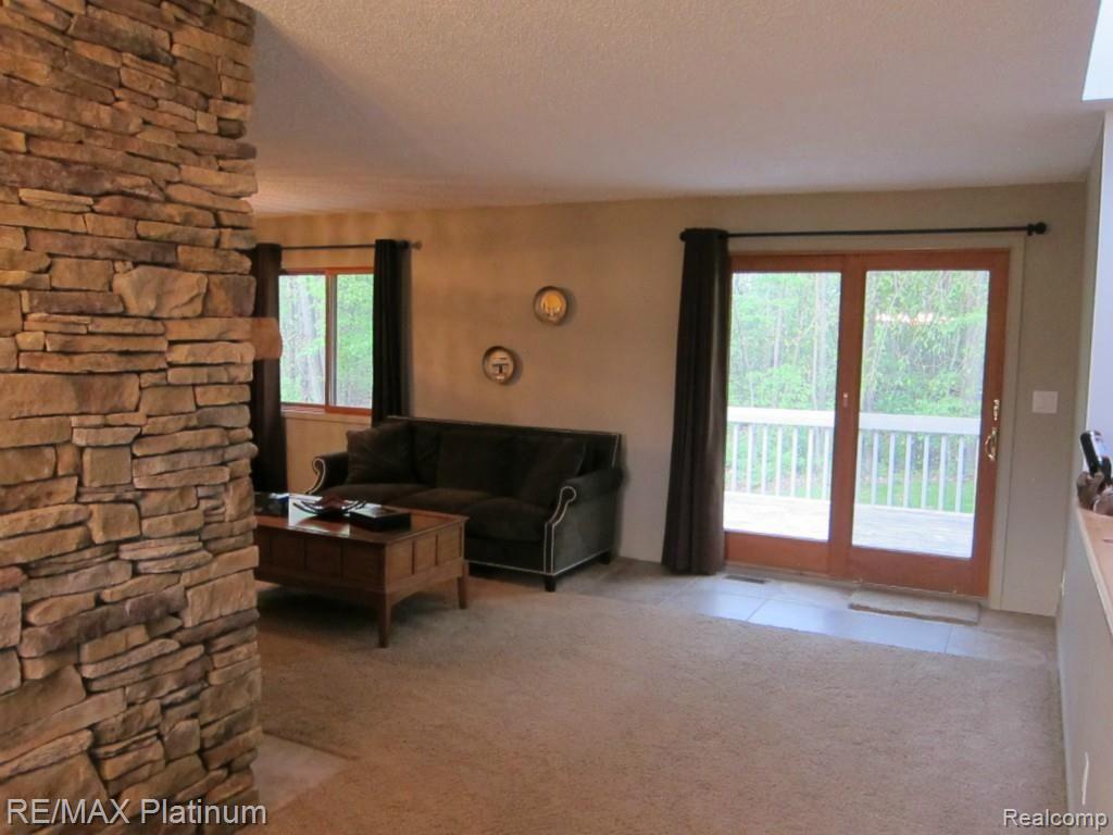 6480 Mack Road Howell, MI 48855 - Photo 22 of 27 Living Room with Doorwall to Deck.