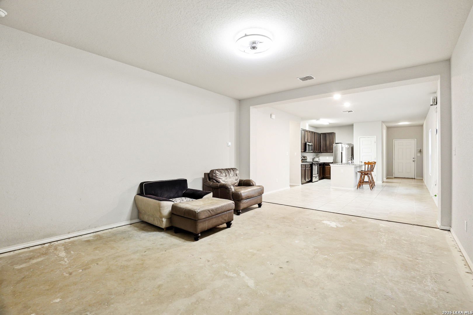 5314 Riley Way St. Hedwig, TX 78152 - Photo 17 of 26 a living room with furniture and a large mirror