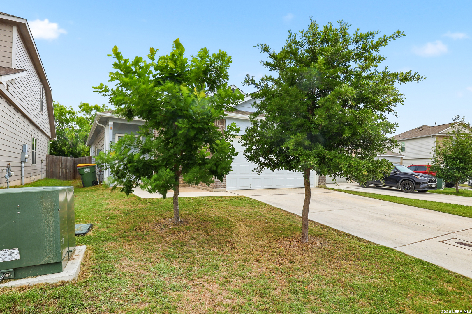 5314 Riley Way St. Hedwig, TX 78152 - Photo 2 of 26 a view of a garden with a tree