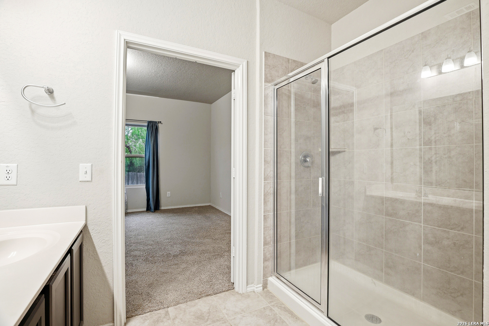 5314 Riley Way St. Hedwig, TX 78152 - Photo 23 of 26 a bathroom with a shower and a sink