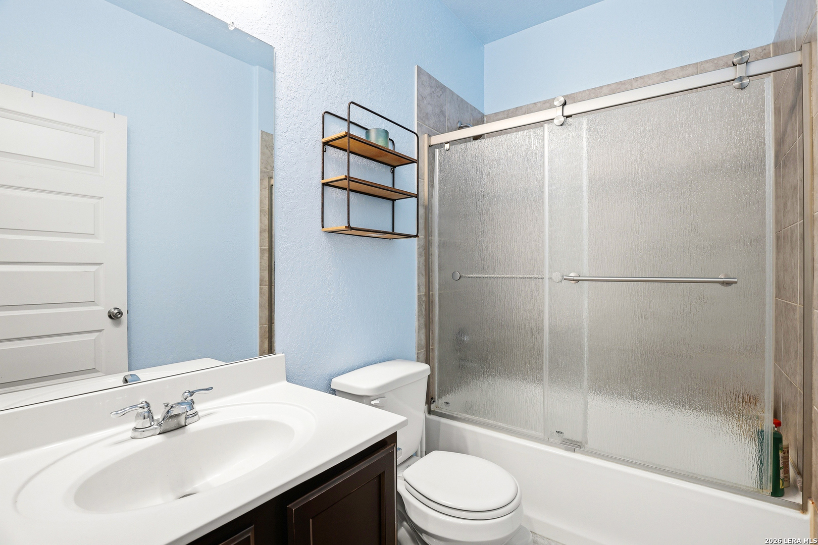5314 Riley Way St. Hedwig, TX 78152 - Photo 4 of 26 a bathroom with a sink toilet and shower