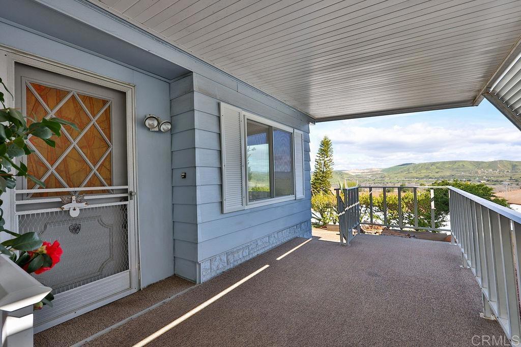 7467 Mission Gorge Road, Unit 203 Santee, CA 92071 - Photo 1 of 1 a view of a balcony with furniture and garden