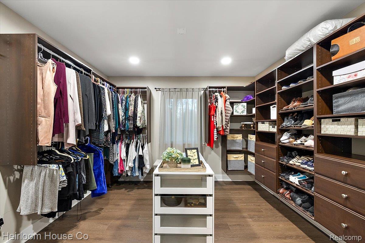 49001 Hanford Road Canton, MI 48187 - Photo 48 of 98 Custom closet system featuring wood-finish flooring, recessed lighting, and a central island with clear drawers