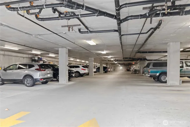 a view of parking garage with cars