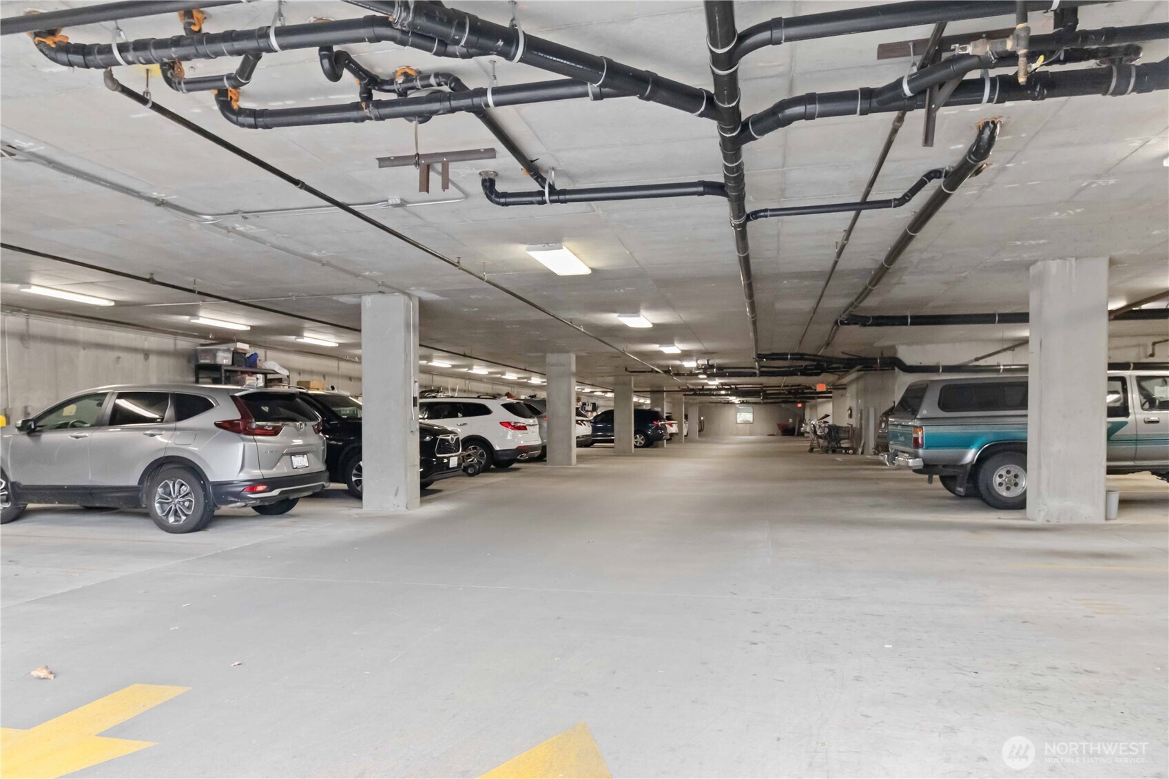 1548 River Road, Unit 302 Longview, WA 98632 - Photo 31 of 37 a view of parking garage with cars