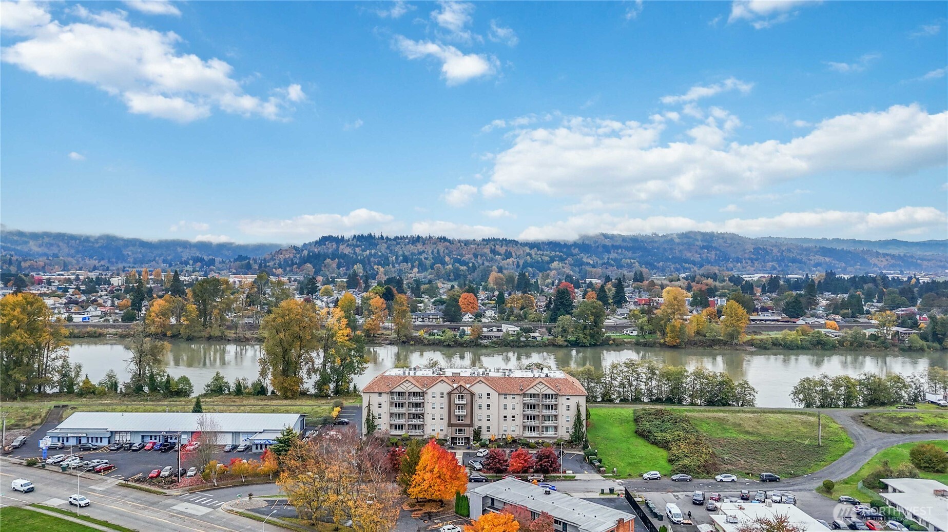 1548 River Road, Unit 302 Longview, WA 98632 - Photo 37 of 37 an aerial view of a city with lots of residential buildings lake and mountain view in back