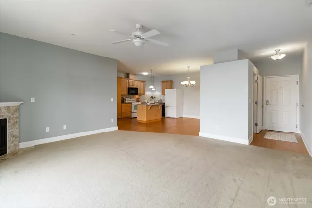 a view of a livingroom with a kitchen