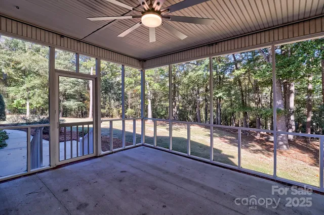 a view of a porch with wooden floor and outdoor space