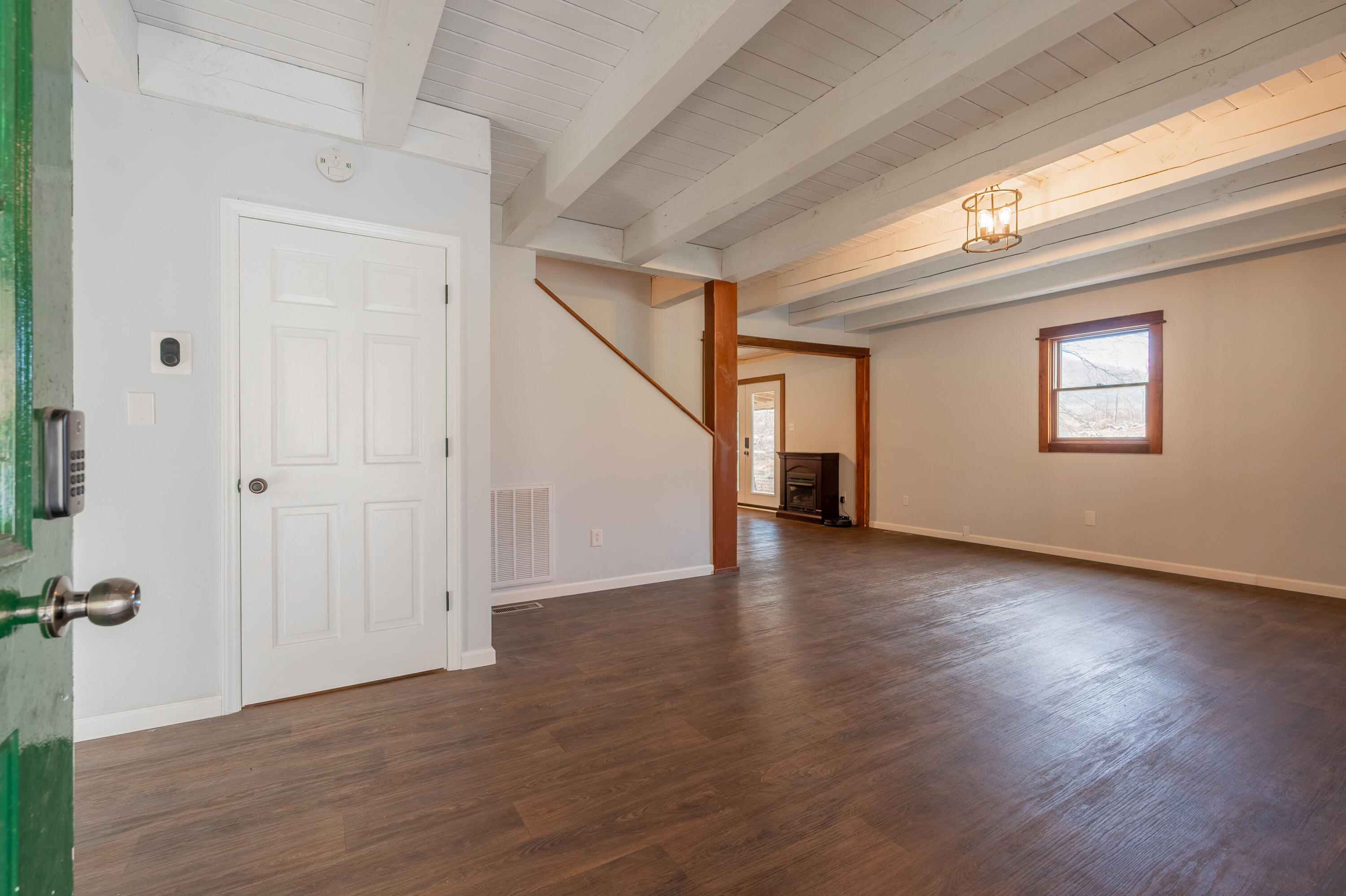 1133 Countyline Church Road Southeast Floyd, VA 24091 - Photo 20 of 97 a view of a livingroom with wooden floor staircase and windows