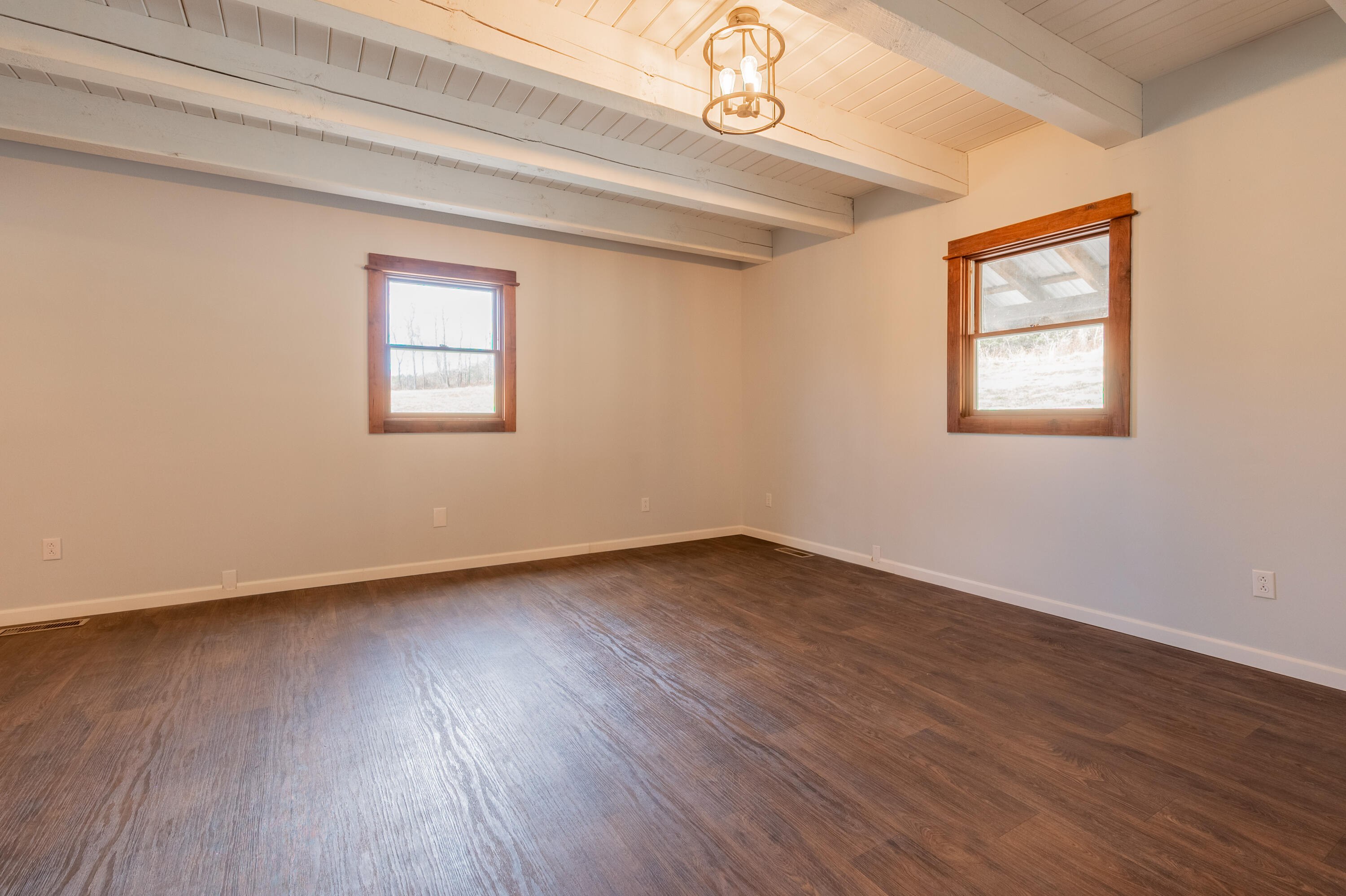 1133 Countyline Church Road Southeast Floyd, VA 24091 - Photo 22 of 97 a view of an empty room with wooden floor and a window