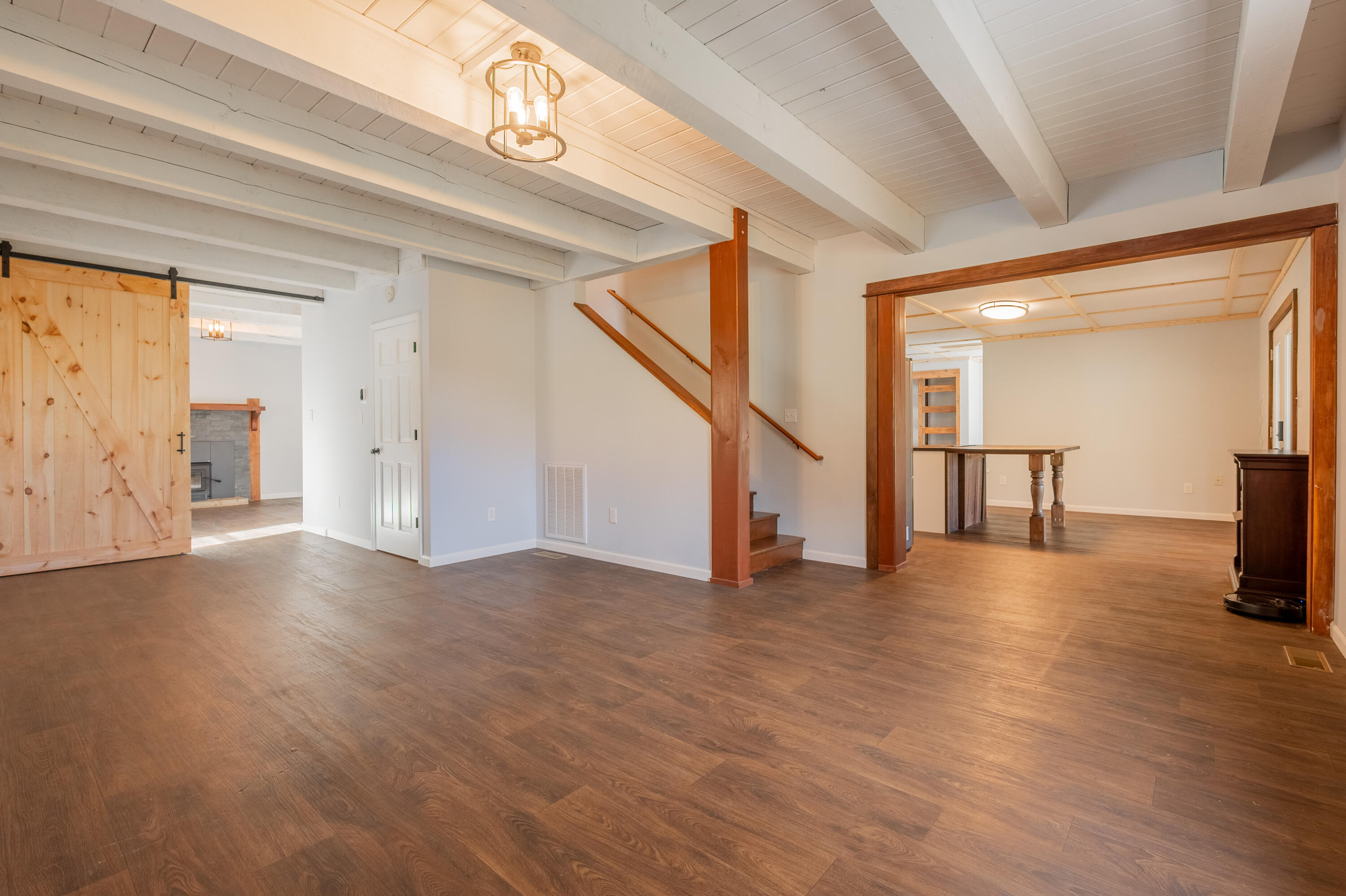1133 Countyline Church Road Southeast Floyd, VA 24091 - Photo 23 of 97 a view of a livingroom with wooden floor and stairs