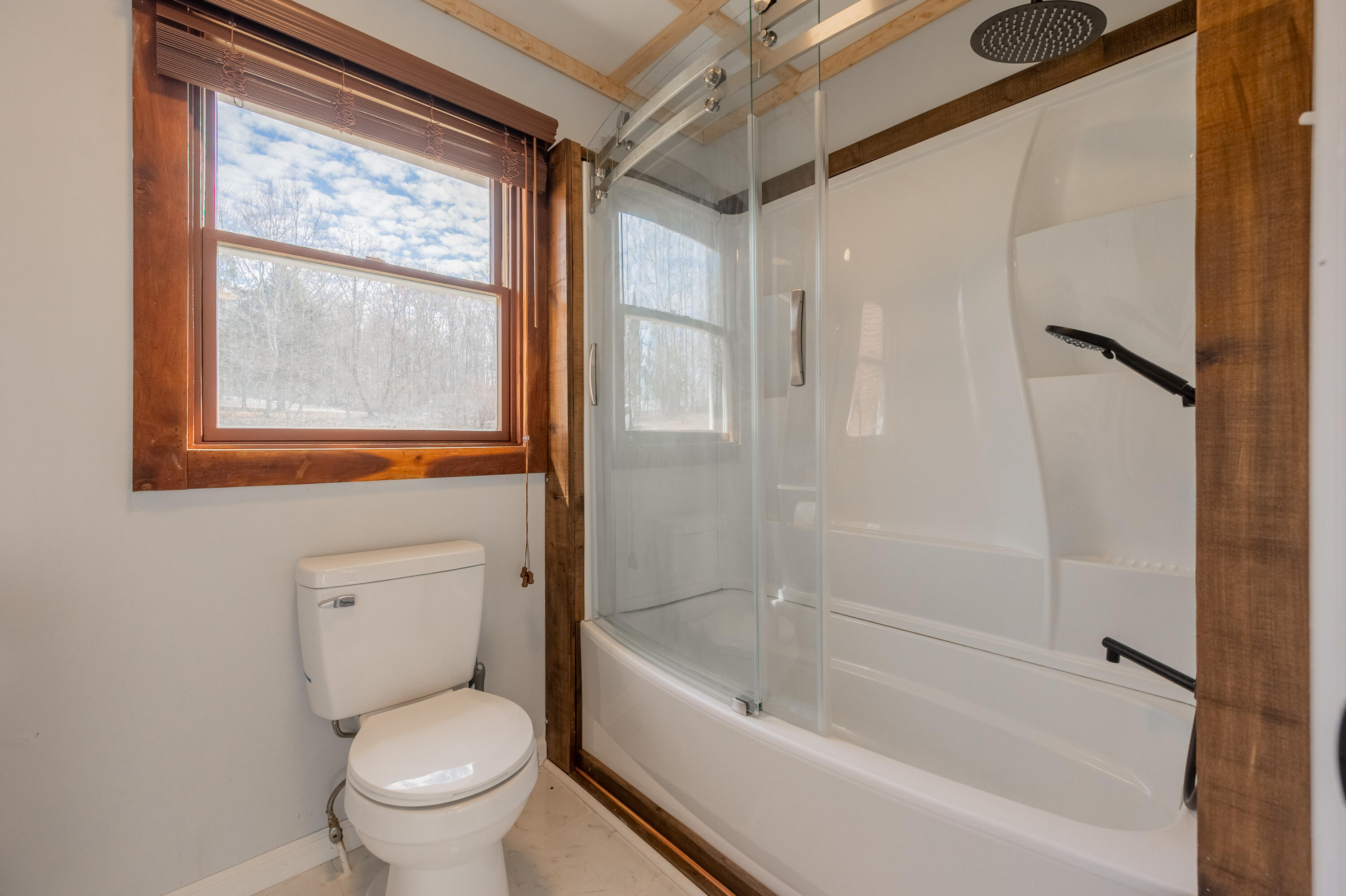 1133 Countyline Church Road Southeast Floyd, VA 24091 - Photo 37 of 97 a bathroom with a granite countertop toilet a sink and a bathtub