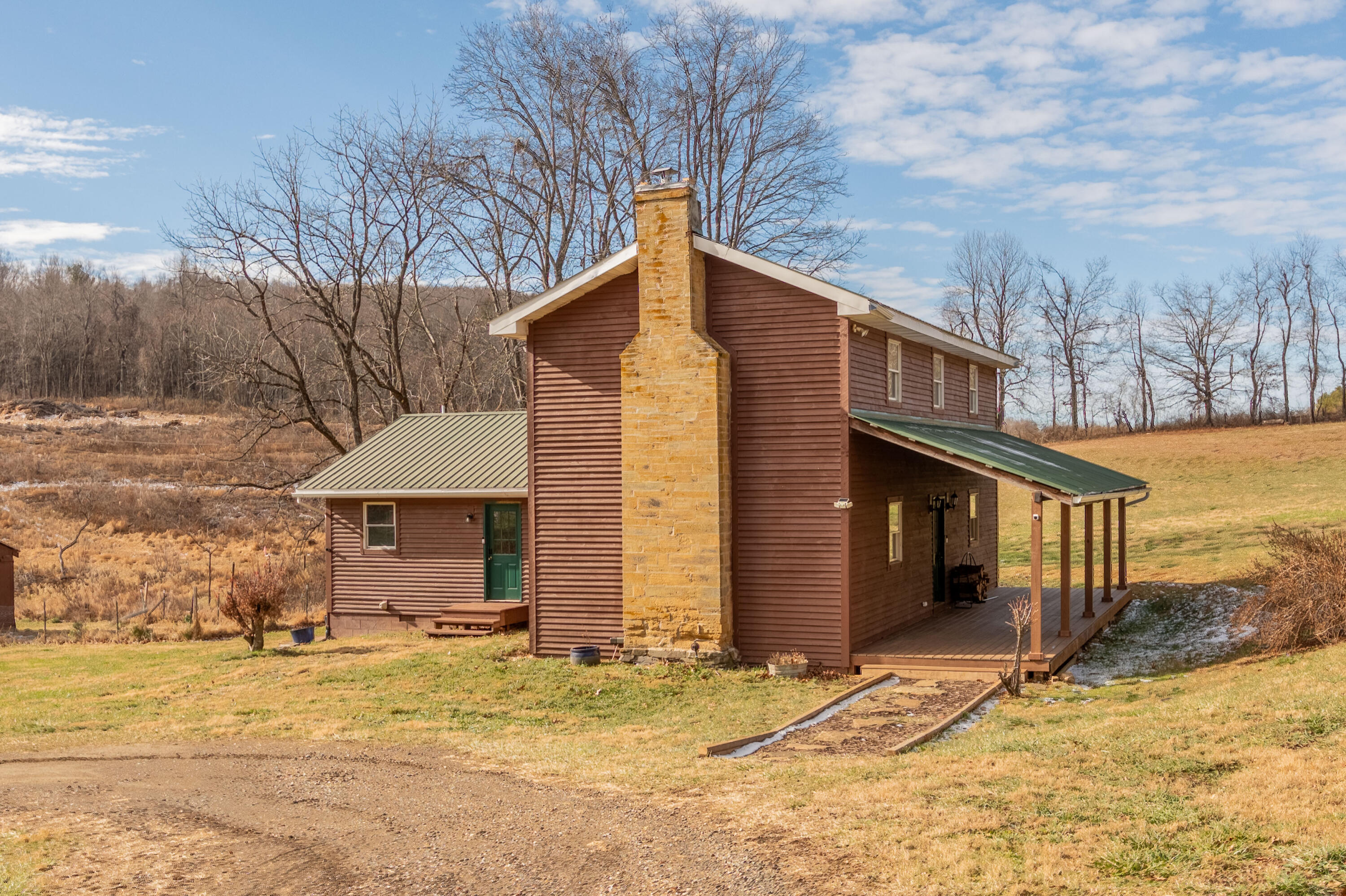 1133 Countyline Church Road Southeast Floyd, VA 24091 - Photo 4 of 97 a front view of a house with a yard and garage
