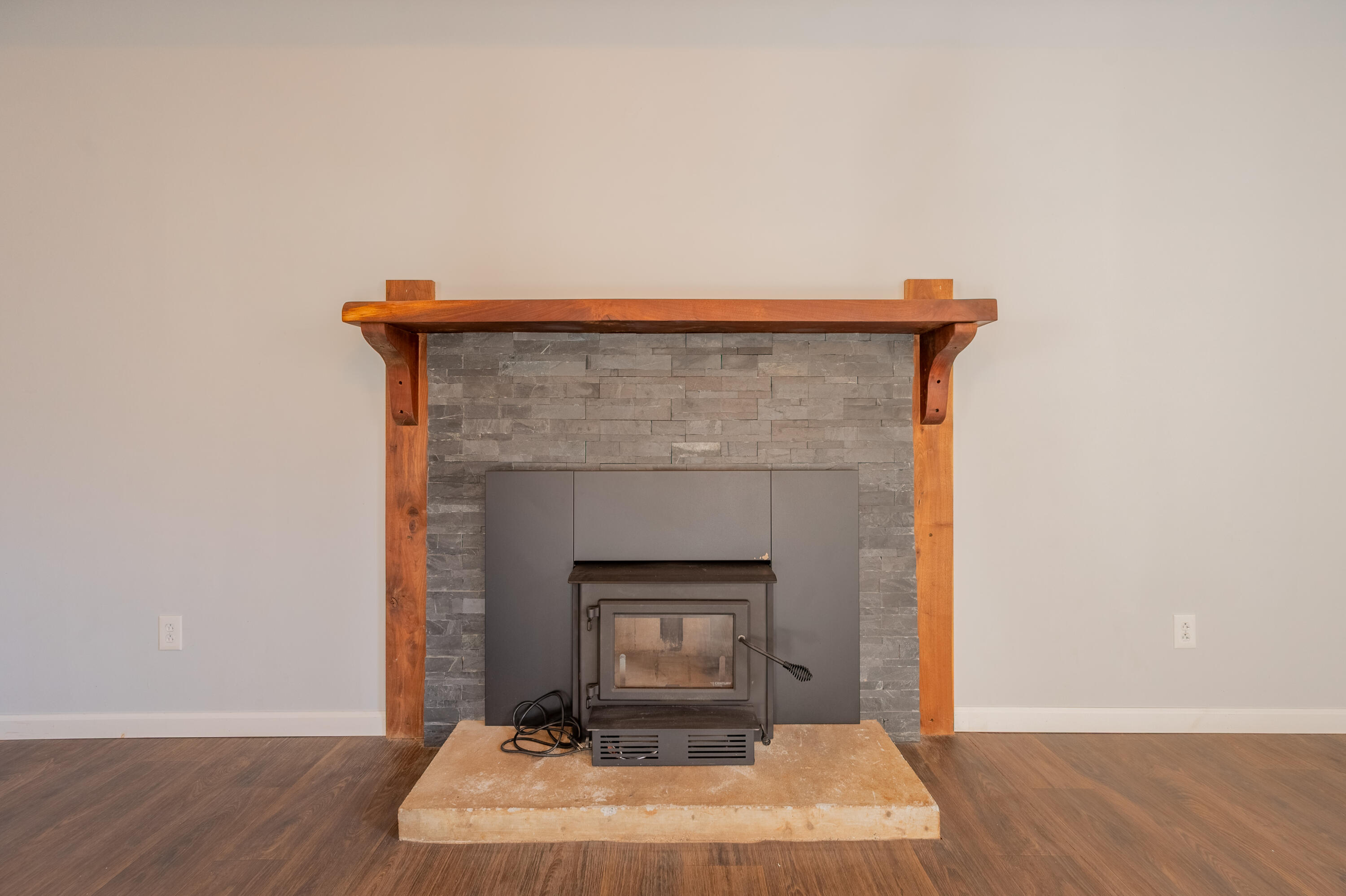 1133 Countyline Church Road Southeast Floyd, VA 24091 - Photo 44 of 97 a room with a fireplace and wooden floor