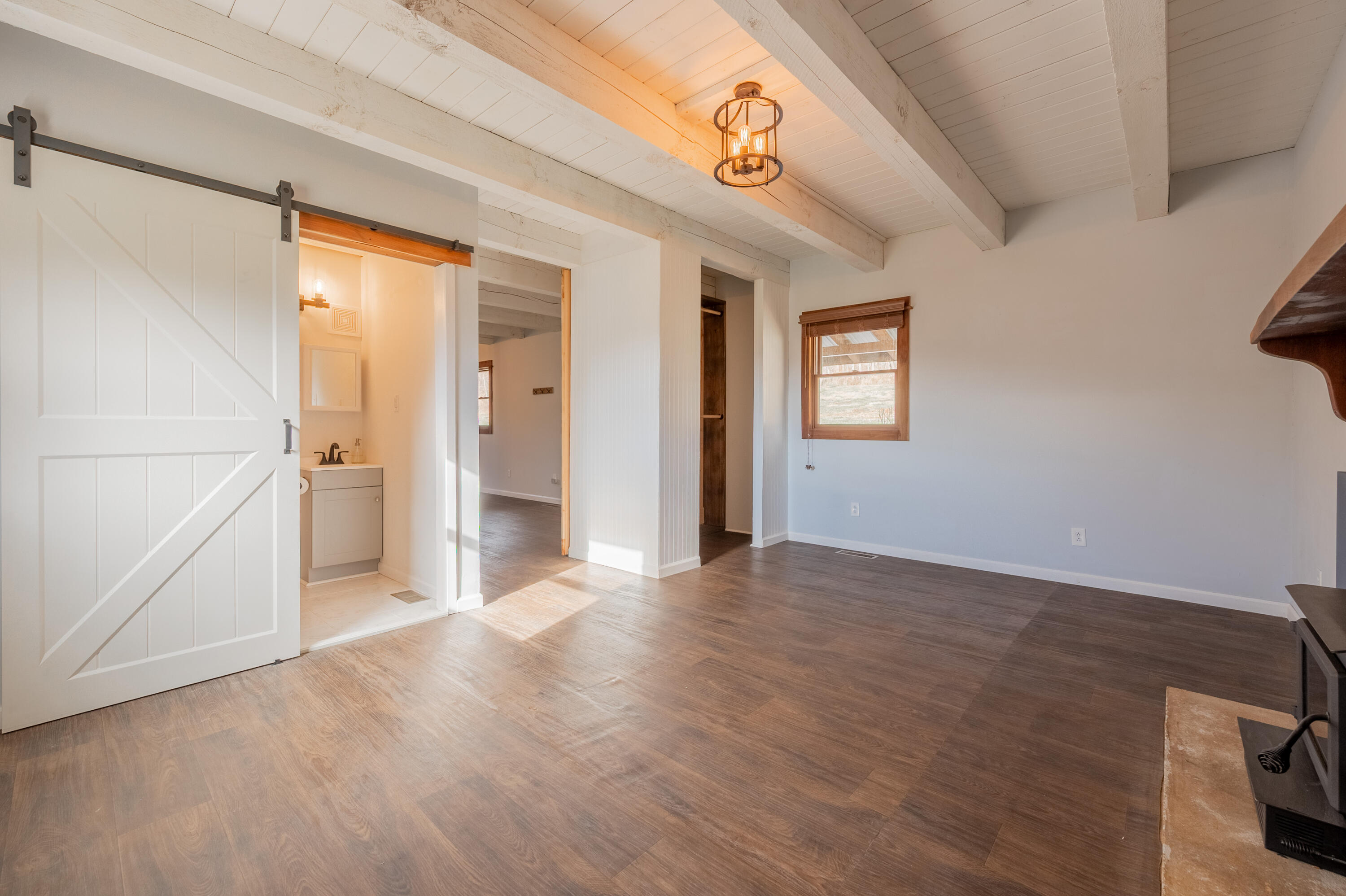 1133 Countyline Church Road Southeast Floyd, VA 24091 - Photo 45 of 97 a view of a hallway with wooden floor and a bathroom