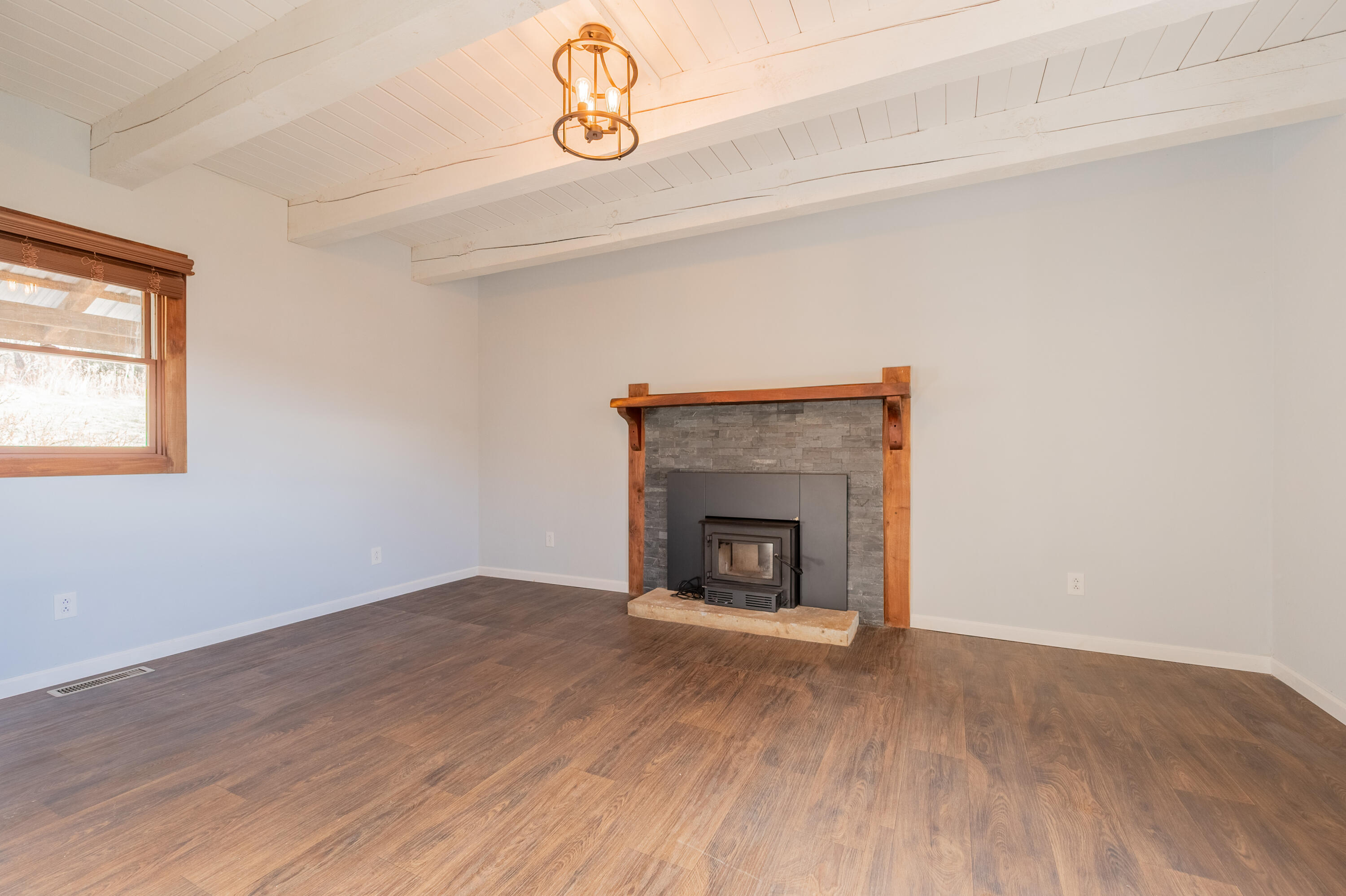 1133 Countyline Church Road Southeast Floyd, VA 24091 - Photo 48 of 97 a view of an empty room with wooden floor and a window