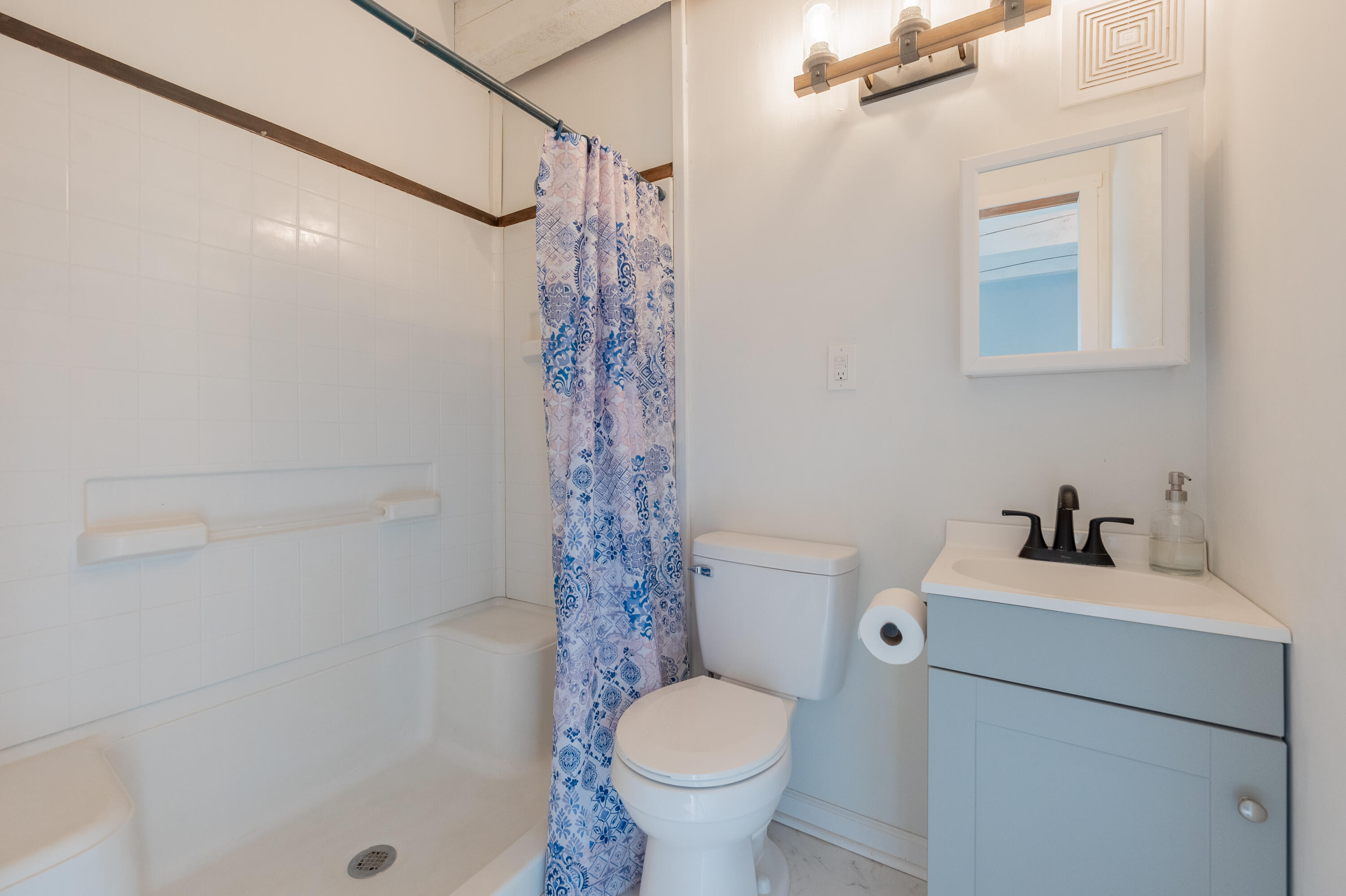 1133 Countyline Church Road Southeast Floyd, VA 24091 - Photo 49 of 97 a bathroom with a sink toilet and shower