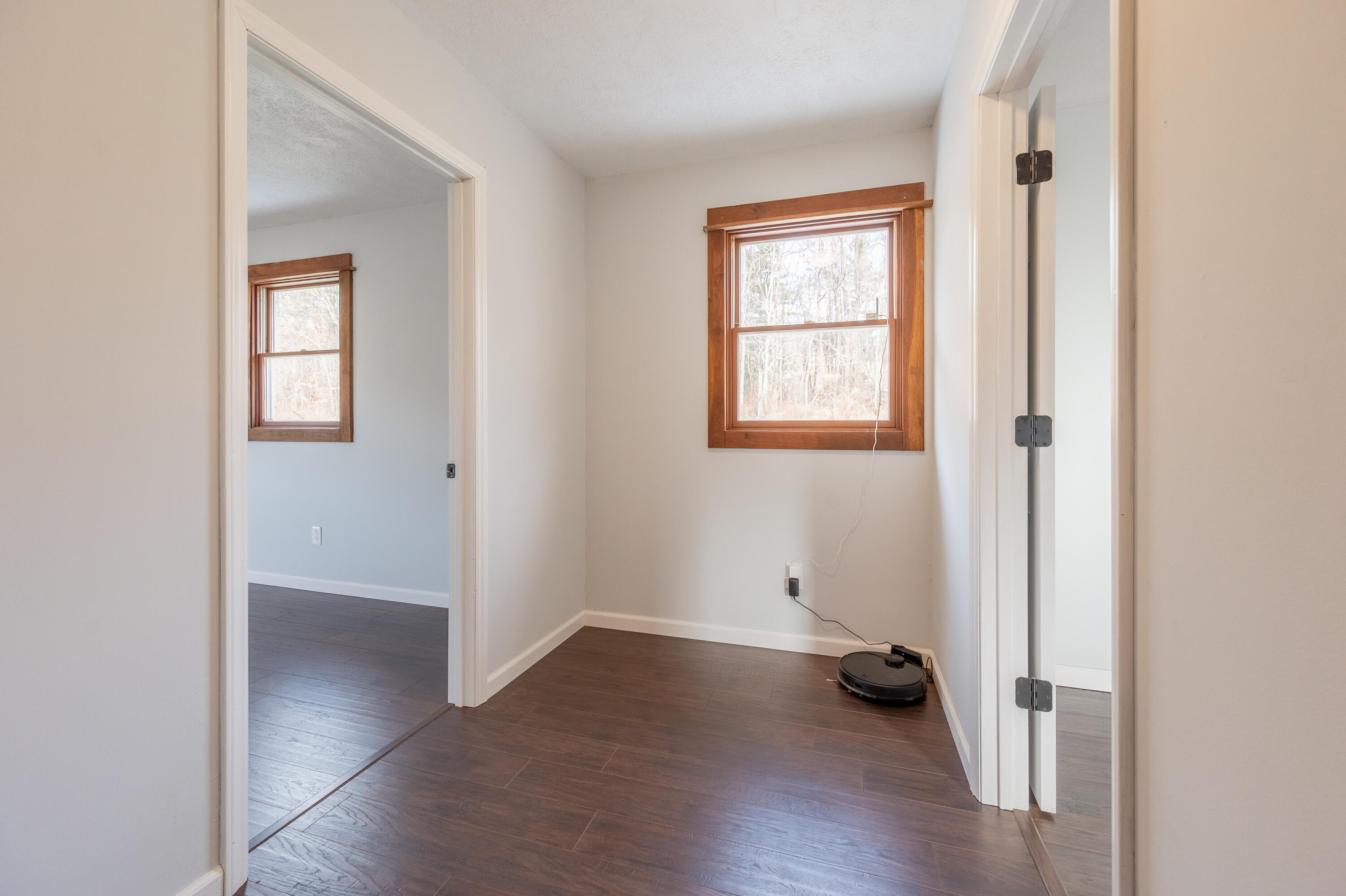1133 Countyline Church Road Southeast Floyd, VA 24091 - Photo 51 of 97 an empty room with wooden floor and windows