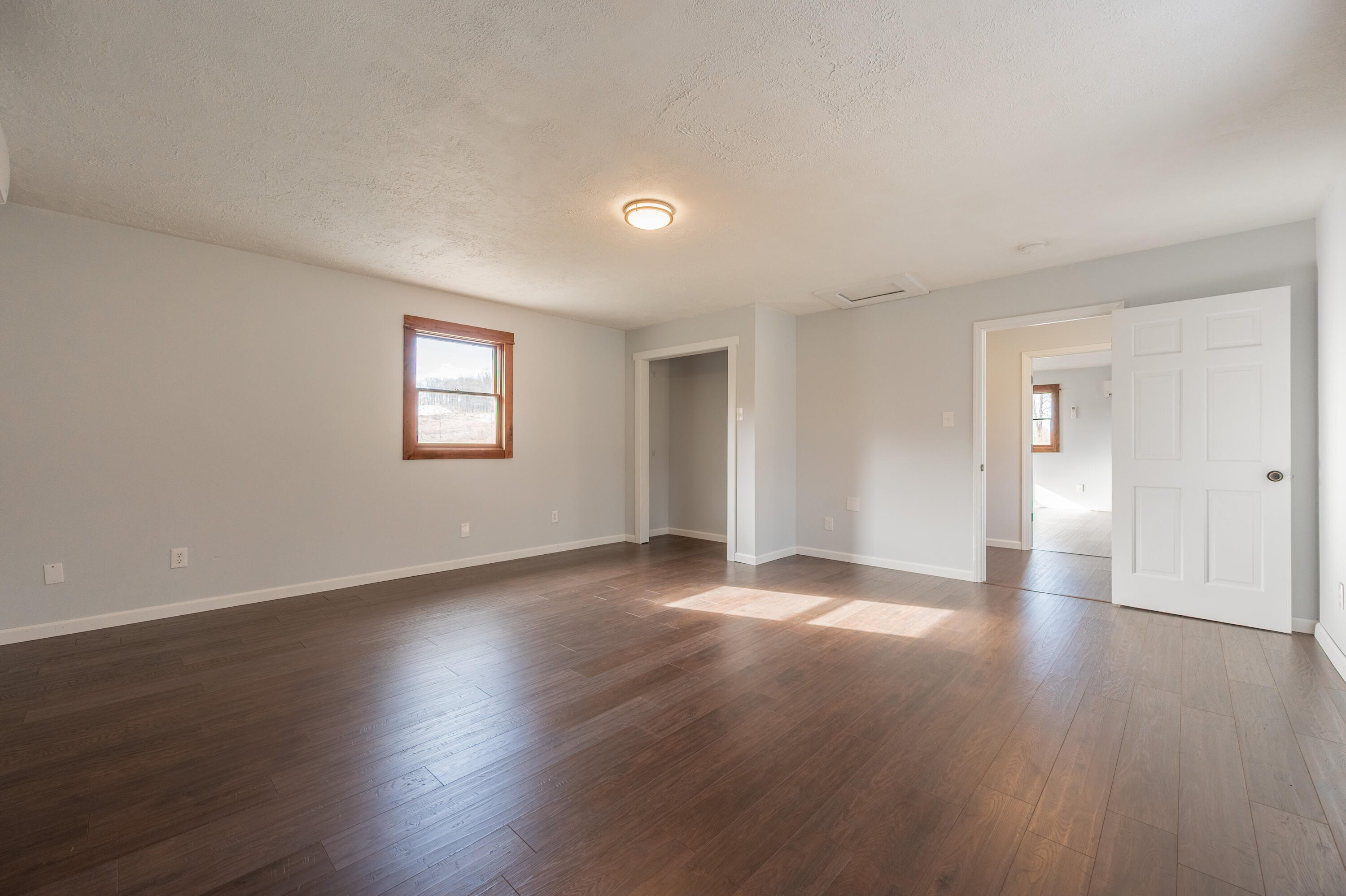 1133 Countyline Church Road Southeast Floyd, VA 24091 - Photo 53 of 97 a view of an empty room with wooden floor and a window