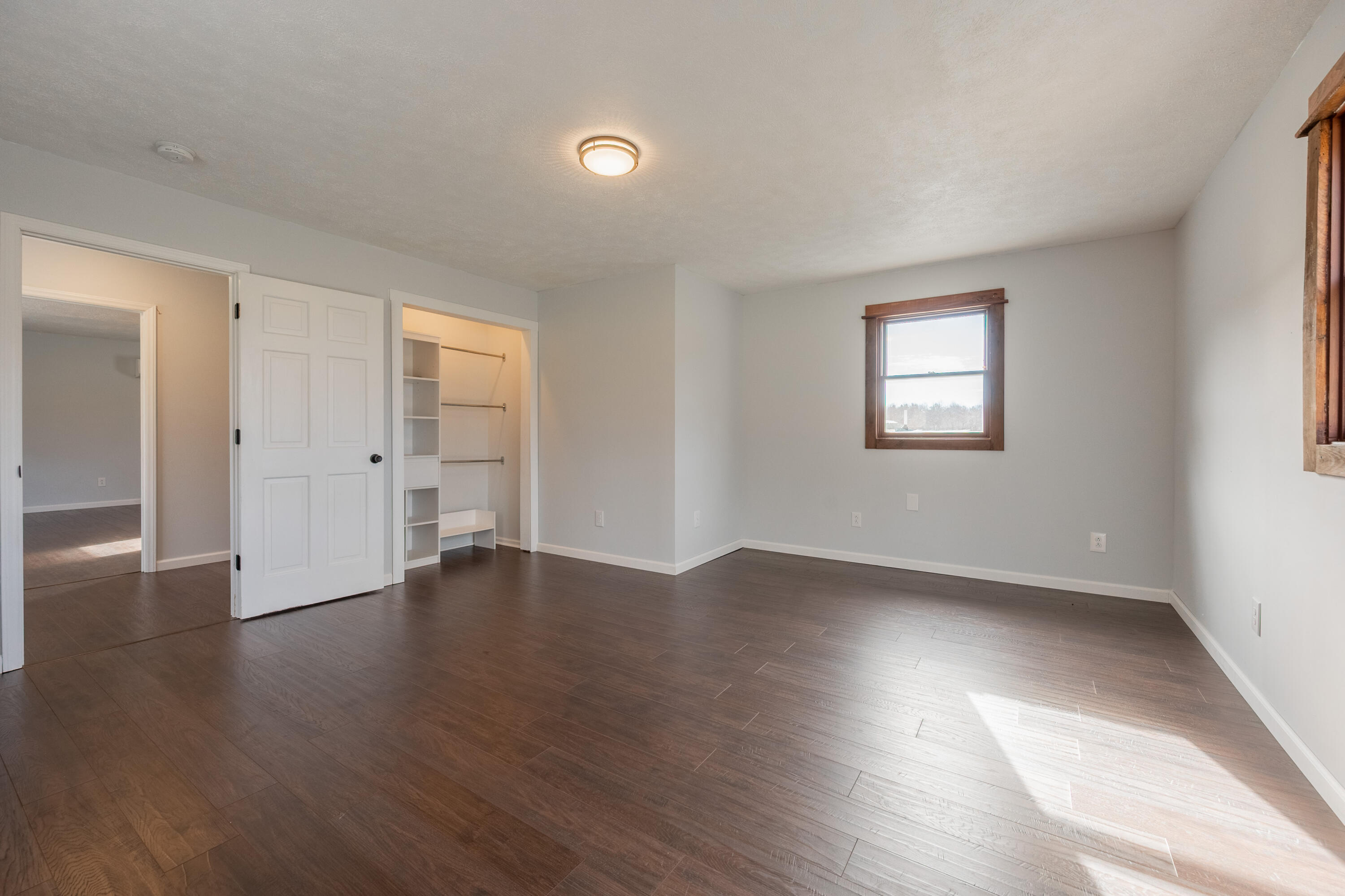1133 Countyline Church Road Southeast Floyd, VA 24091 - Photo 57 of 97 an empty room with wooden floor and windows