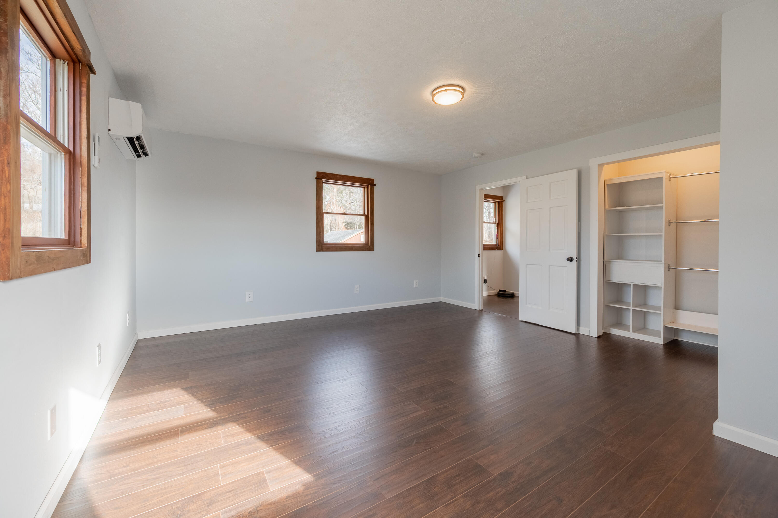 1133 Countyline Church Road Southeast Floyd, VA 24091 - Photo 58 of 97 an empty room with wooden floor and windows