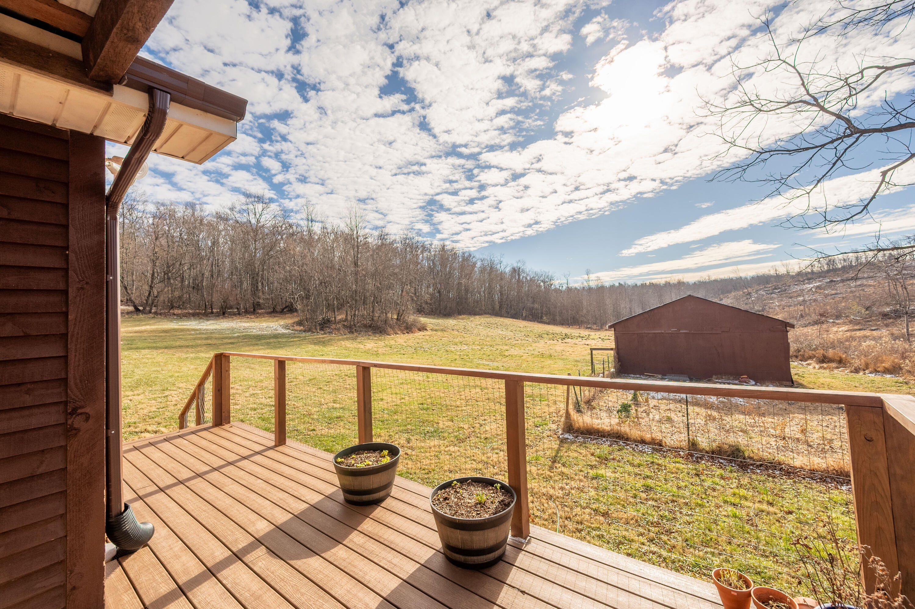 1133 Countyline Church Road Southeast Floyd, VA 24091 - Photo 64 of 97 a view of balcony with floor to ceiling windows with wooden floor