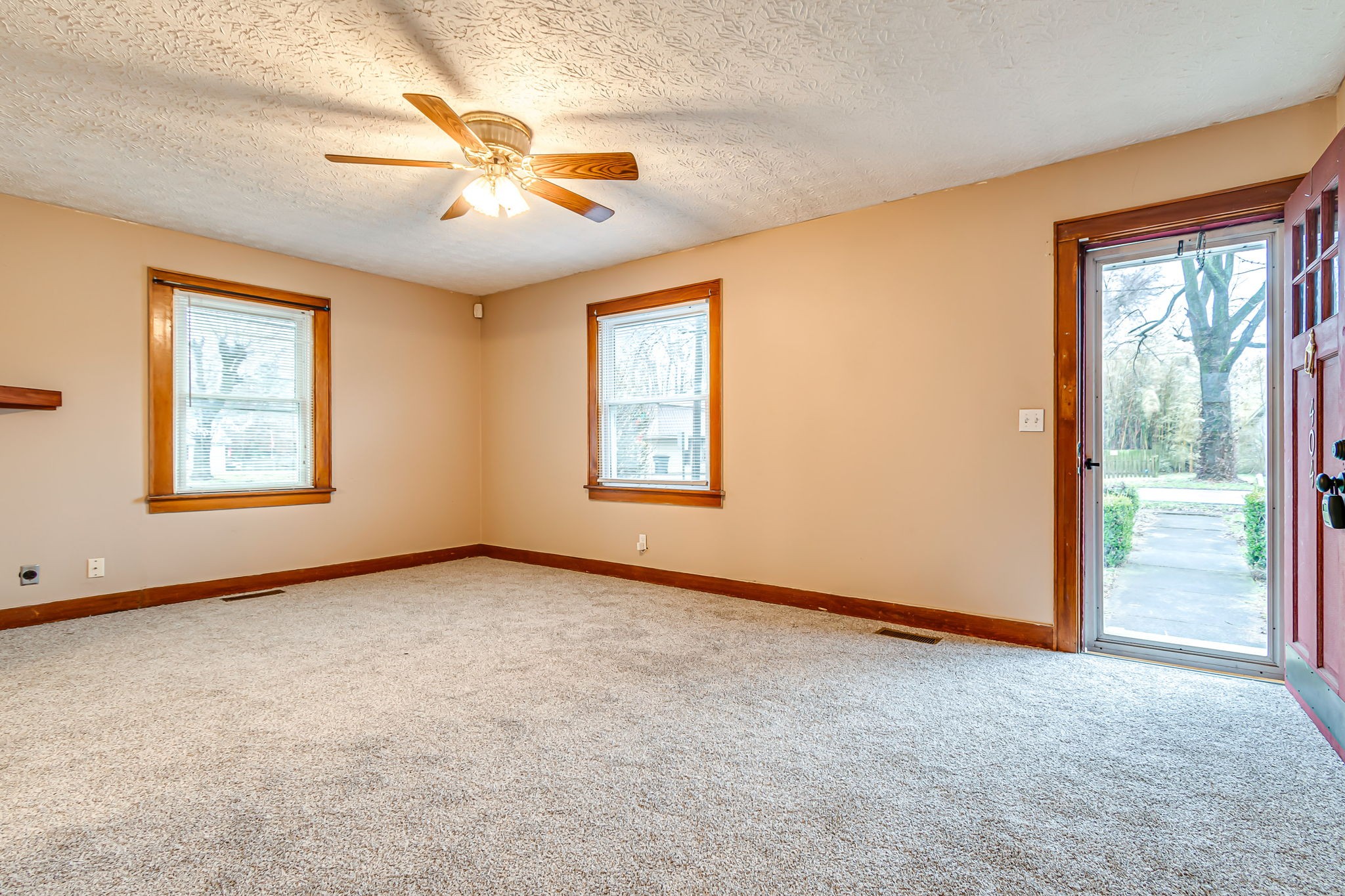 404 Gibson Street Portland, TN 37148 - Photo 3 of 11 an empty room with windows and fan