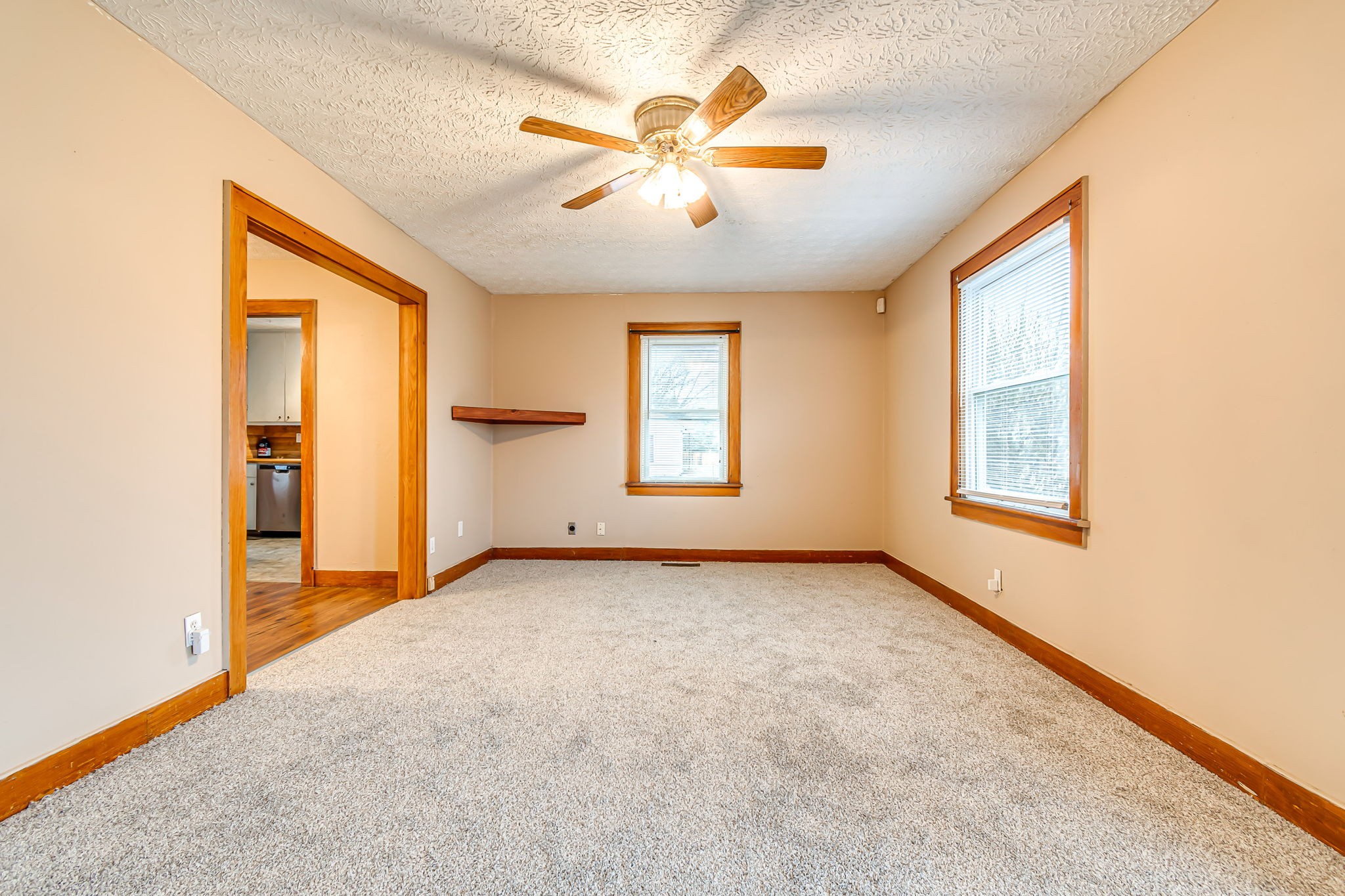 404 Gibson Street Portland, TN 37148 - Photo 5 of 11 an empty room with windows and ceiling fan