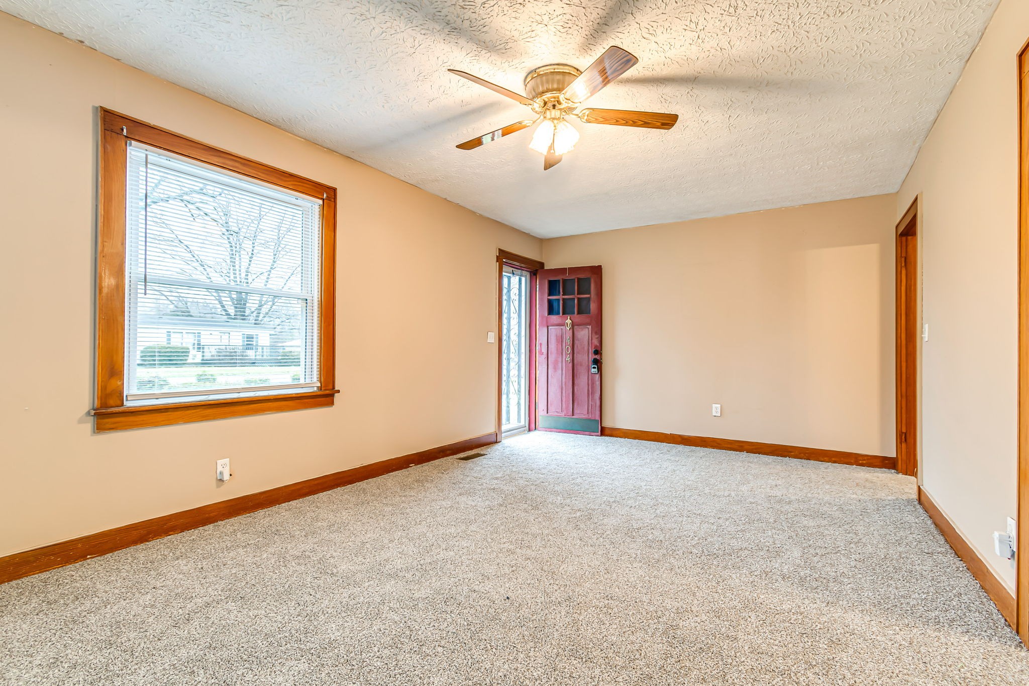 404 Gibson Street Portland, TN 37148 - Photo 6 of 11 an empty room with windows and fan