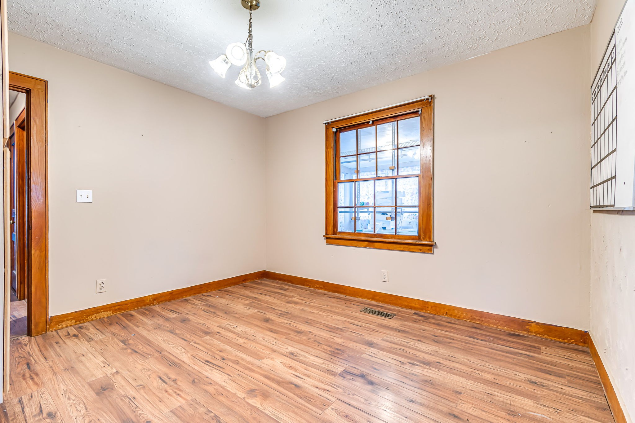 404 Gibson Street Portland, TN 37148 - Photo 7 of 11 a view of an empty room with wooden floor and a window