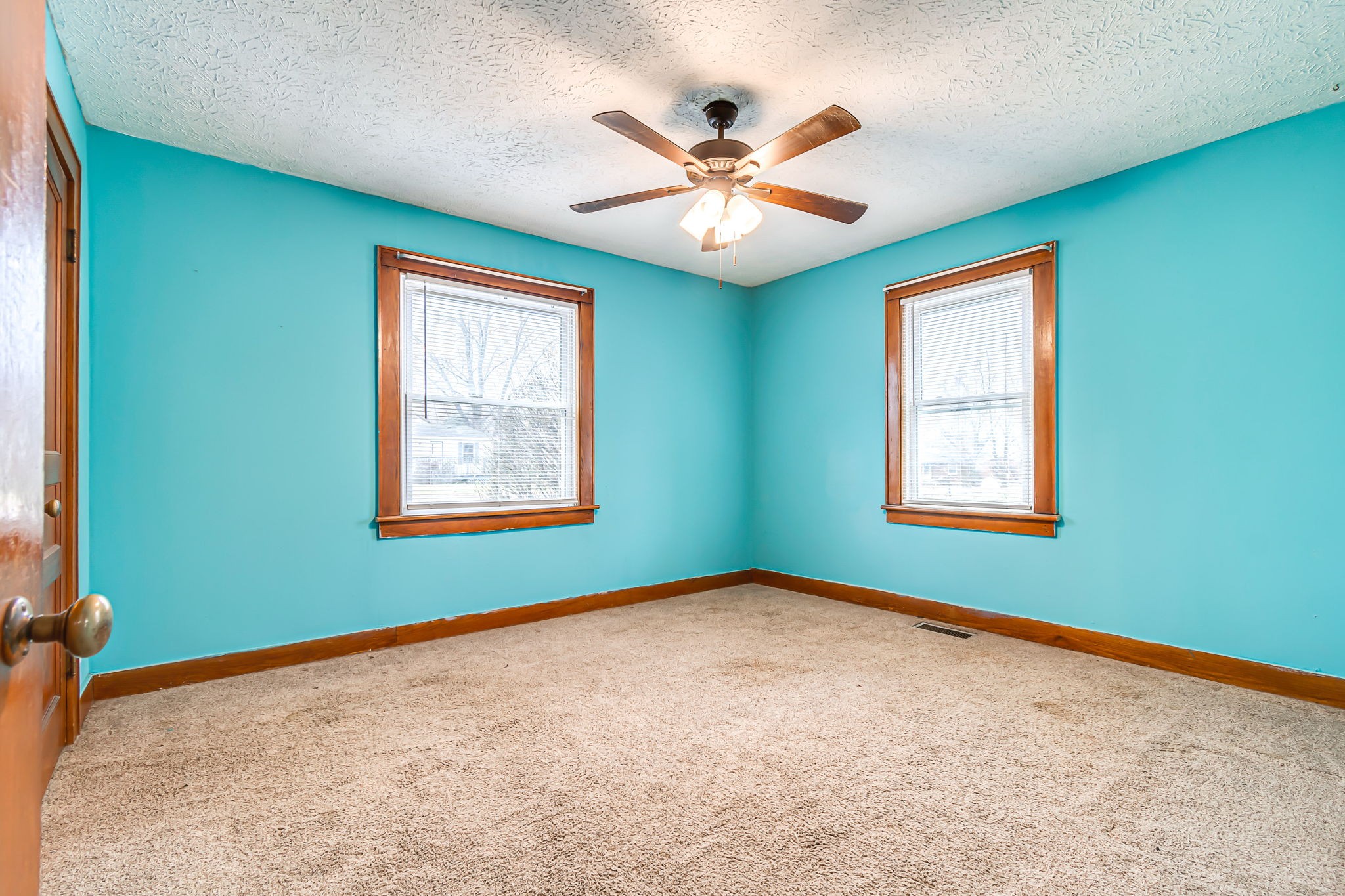 404 Gibson Street Portland, TN 37148 - Photo 9 of 11 a view of a big room with windows and chandelier fan