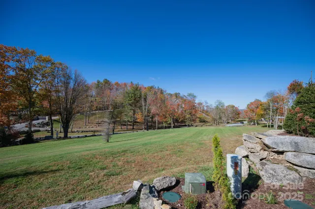 a view of a field with sitting area