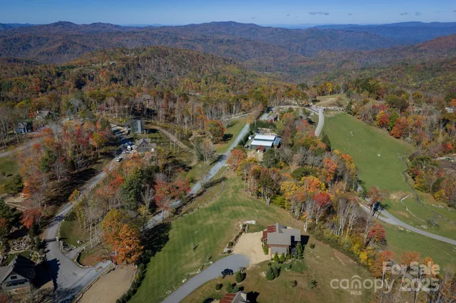 an aerial view of residential house and sandy dunes