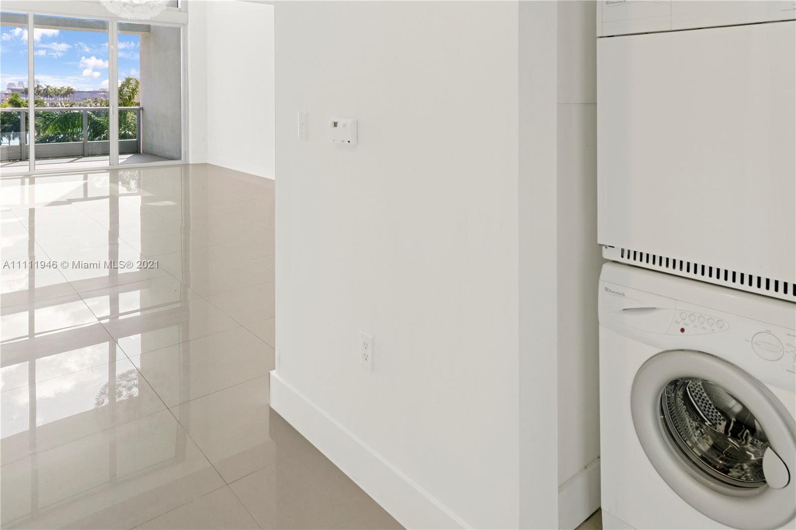 900 Biscayne Boulevard, Unit 507 Miami, FL 33132 - Photo 13 of 20 a close up view of a washer and dryer