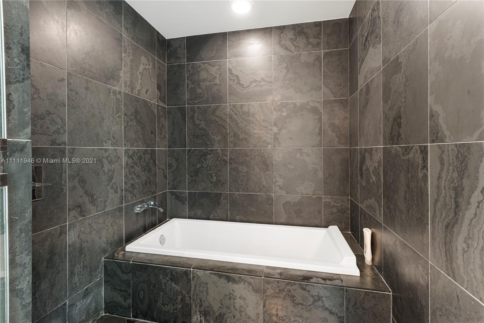 900 Biscayne Boulevard, Unit 507 Miami, FL 33132 - Photo 16 of 20 a bathroom with a shower
