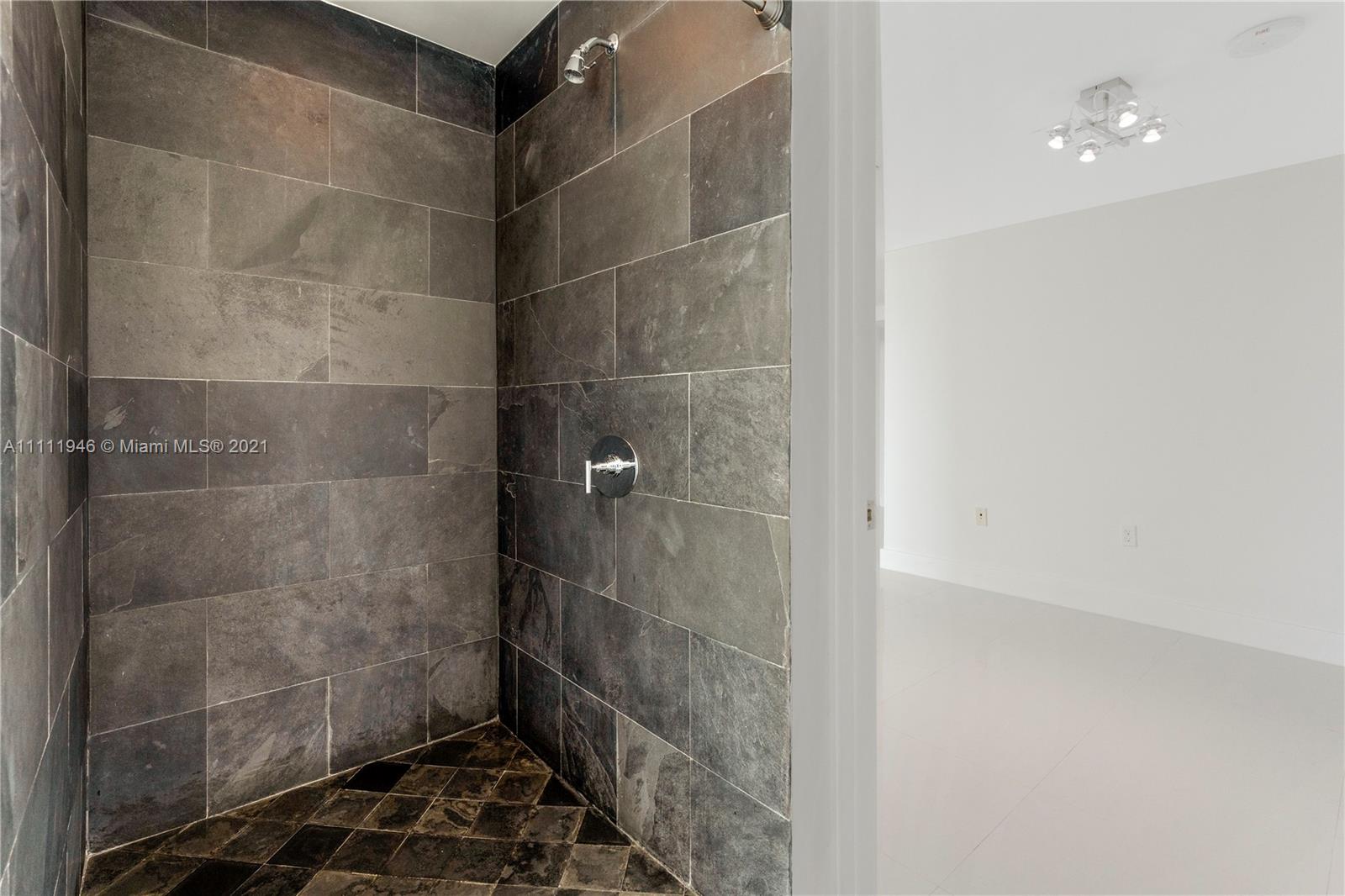 900 Biscayne Boulevard, Unit 507 Miami, FL 33132 - Photo 8 of 20 a bathroom with a glass door shower