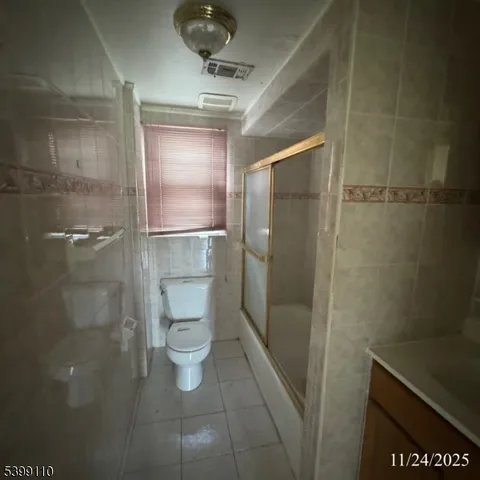 a bathroom with a shower and toilet