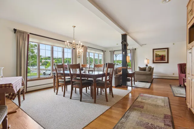 a view of a dining room with furniture window and outside view