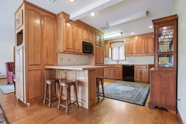 a kitchen with stainless steel appliances granite countertop a refrigerator oven stove a sink and dishwasher