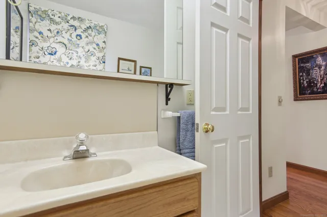 a bathroom with a sink and vanity