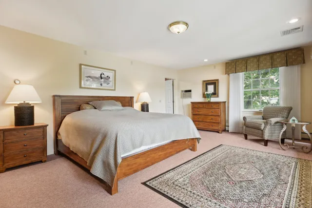 a bed room with a bed and a couch