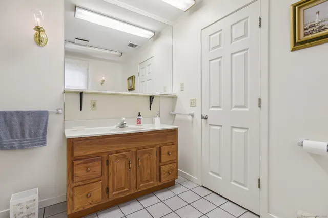 a room with a sink cabinets and utility room