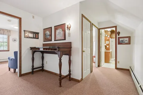 a view of room with furniture and windows