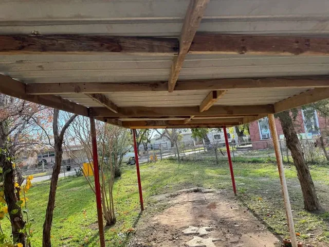 a view of a bathroom with a sink and a mirror