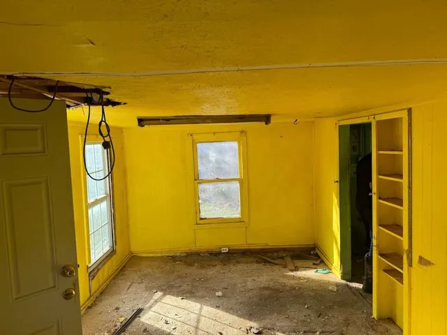 a view of a room with windows