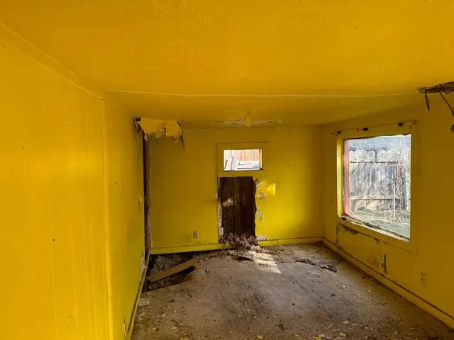 a view of a room that has a window in it