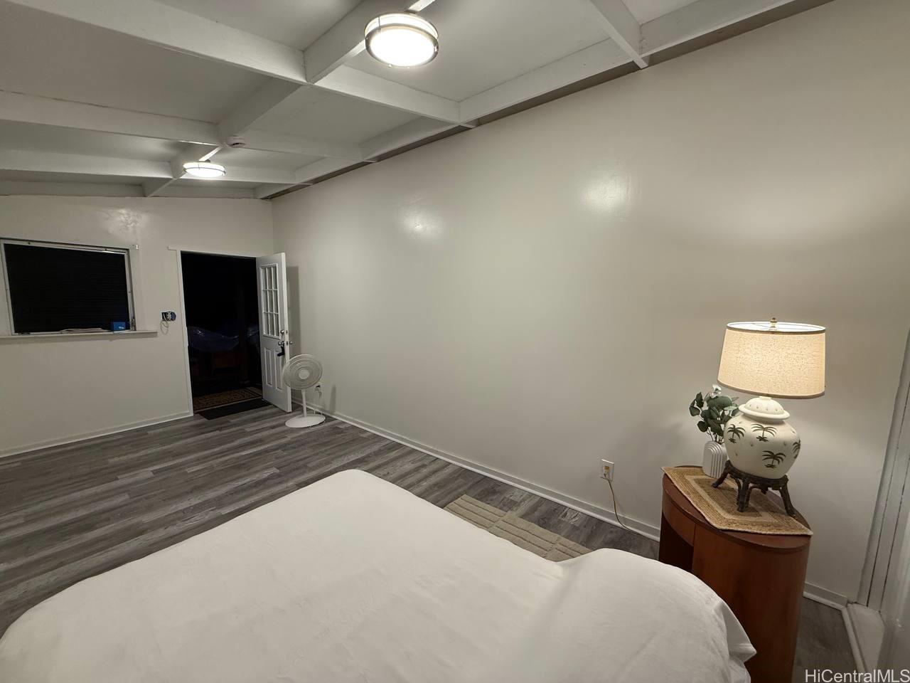 82 Hoku Street, Unit D Hilo, HI 96720 - Photo 12 of 15 a bedroom with a bed and a tv