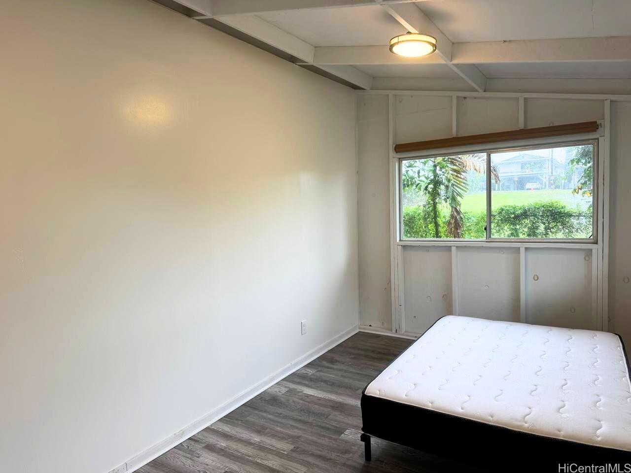 82 Hoku Street, Unit D Hilo, HI 96720 - Photo 15 of 15 a bedroom with a bed and a window