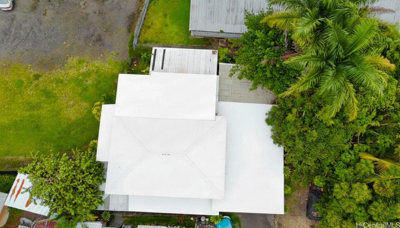82 Hoku Street, Unit D Hilo, HI 96720 - Photo 2 of 15 an aerial view of a house with a yard and garden